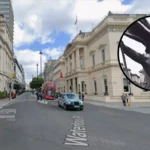 Banksy‑style statue of man blinded by flag appears in Waterloo Place London 2026